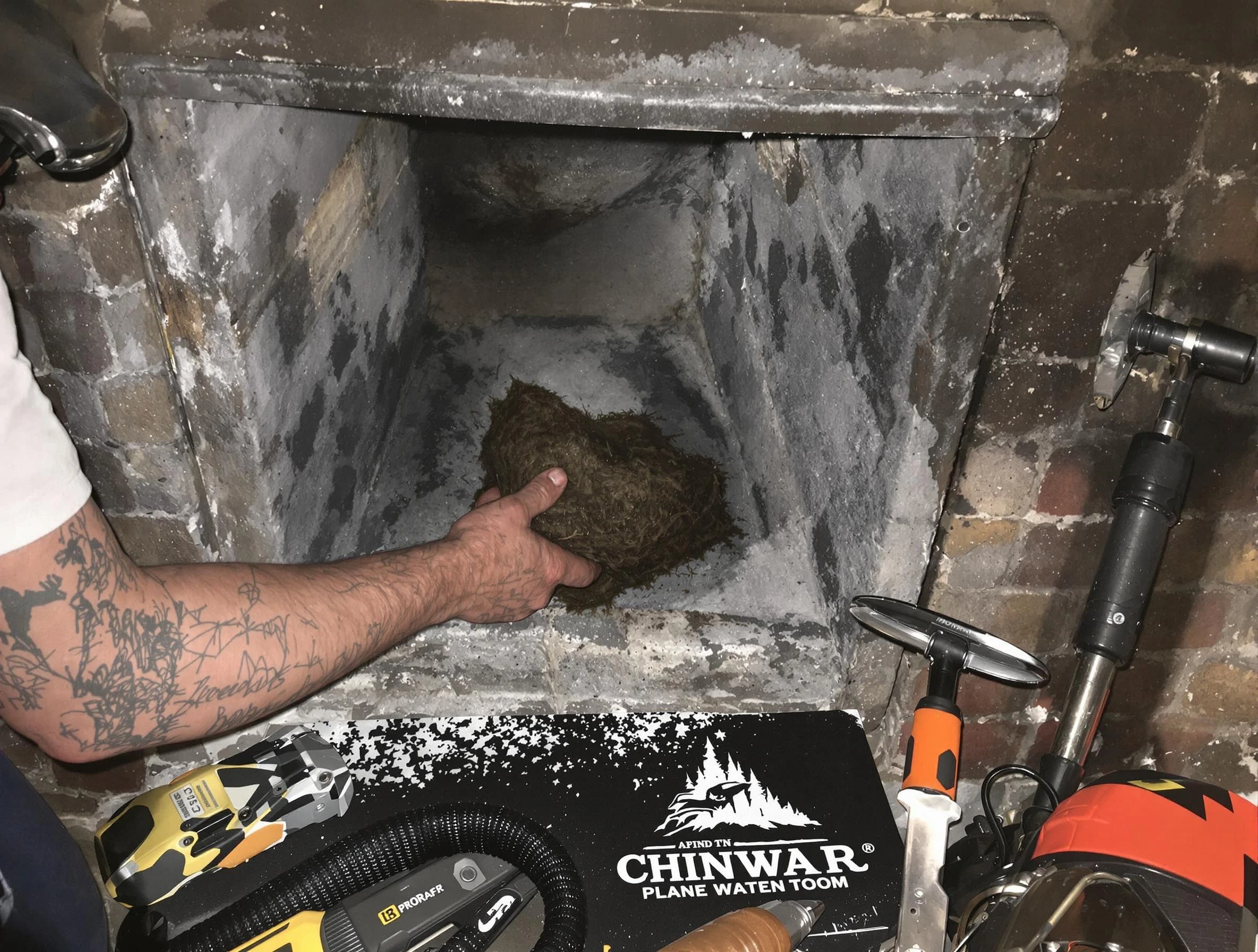 Fairview Chimney Sweep safely removing debris and screening chimney in Fairview, TN